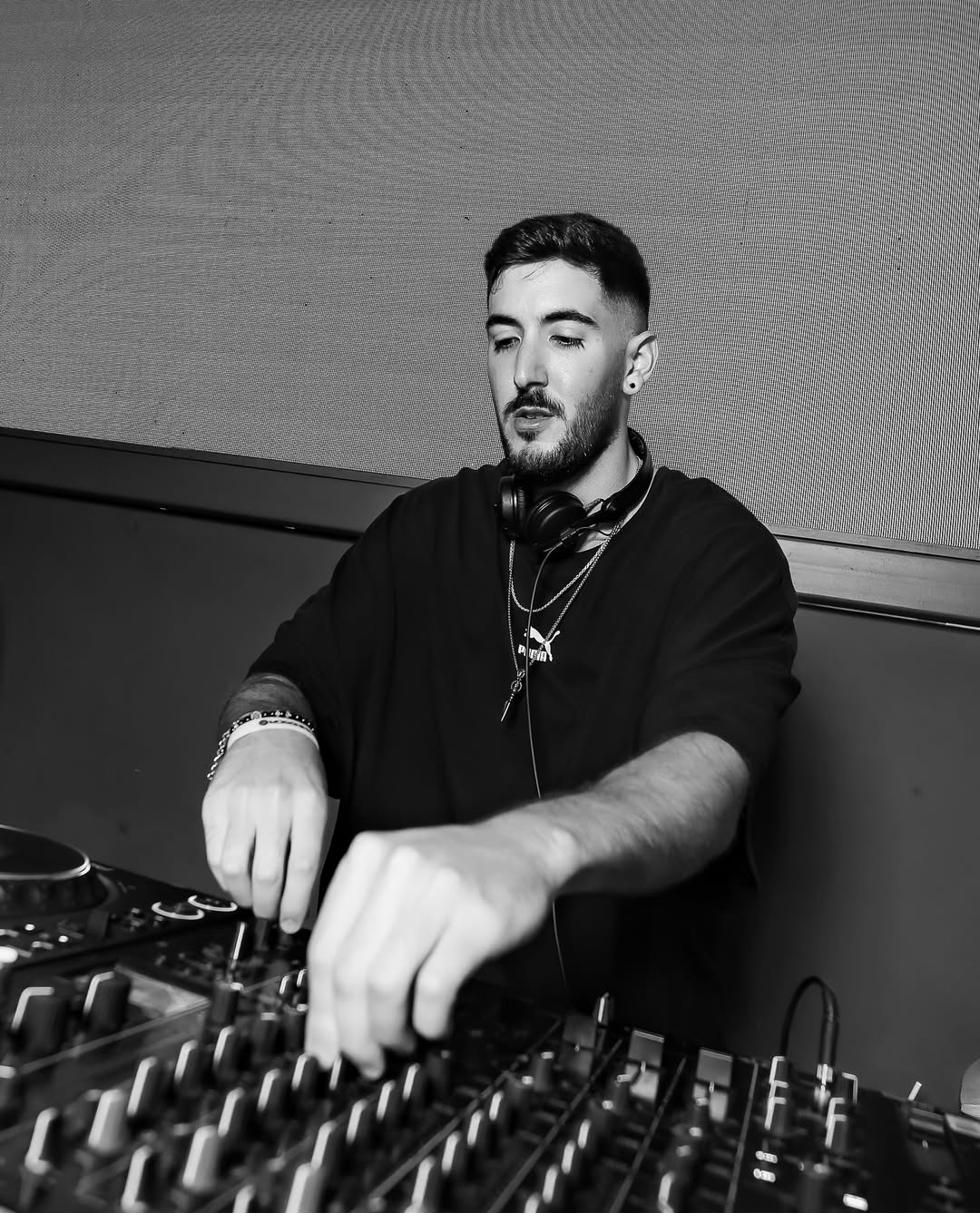 Close-up of 1LINE's hands working the mixer mid-set